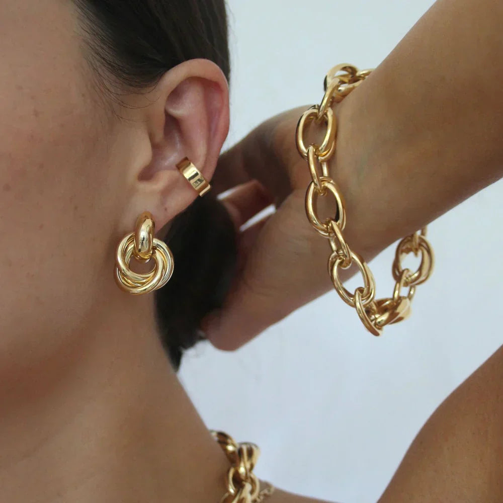 Pendientes Inter interlocking de Impacto | Oro