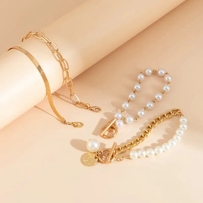 Set de Pulseras Chic de Oro de 4 Piezas - Serpiente, Perlas y Eslabones | Oro